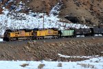 UP 9049, 7109 (SD70ACE, C44ACM) lead a westbound manifest at Castle Rock, Utah. February 19, 2022 {Winter Echofest}